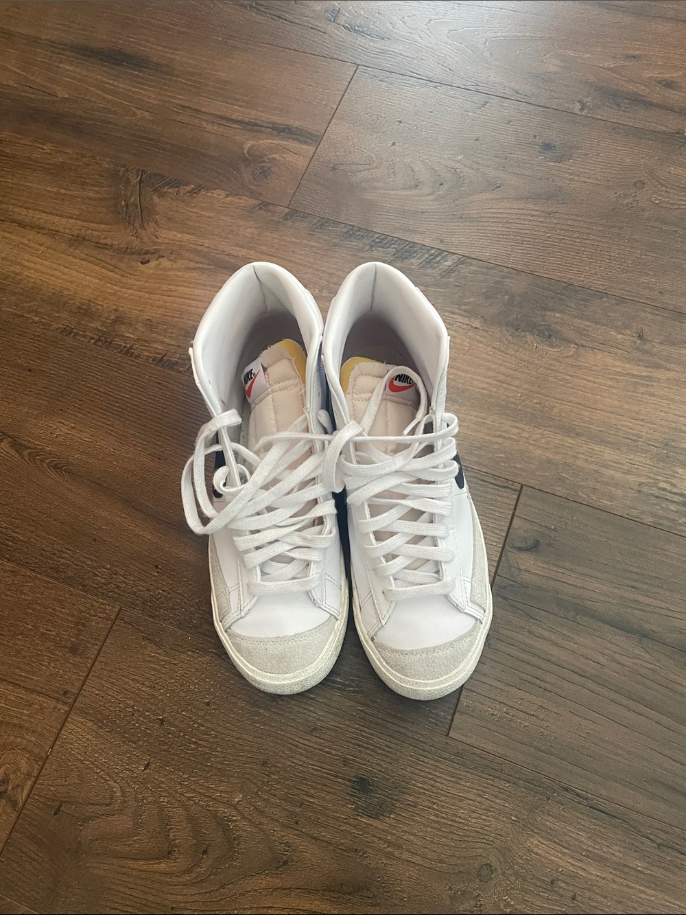 Nike White High-Top Sneakers with Black Swoosh
